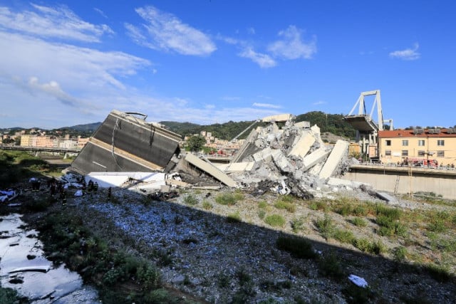 Rubble and debris from the collapsed Morandi motorway bridge is seen strewn along the railway line in the northern port city of Genoa on August 14, 2018. Photo: Valery Hache / AFP